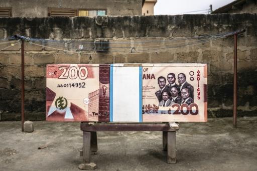 A coffin designed to look like a 200 cedi banknote will carry a Ghanaian banker to his final resting place — OLYMPIA DE MAISMONT / AFP