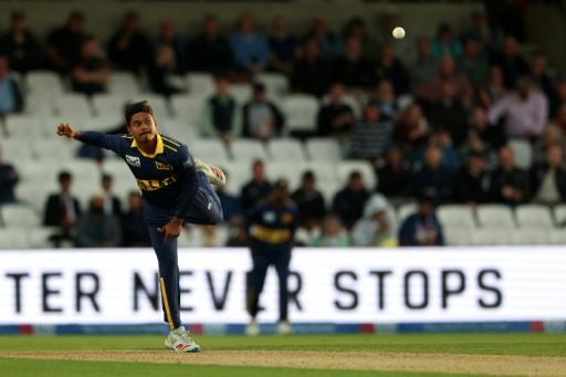 Sri Lanka's Dunith Wellalage bowls during the second ODI against England at Headingley — Darren Staples / AFP