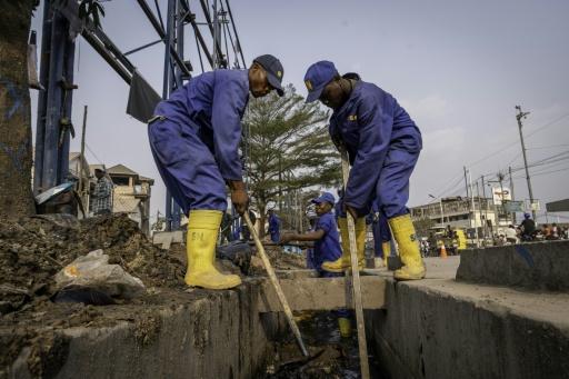 The street cleaners are former gang members drafted into a paramilitary National Service force — GLODY MURHABAZI / AFP