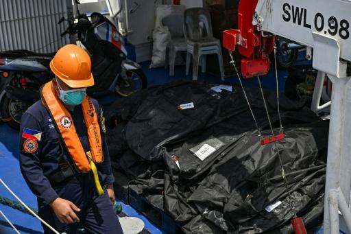 Philippine rescuers pull more victims from charred ferry