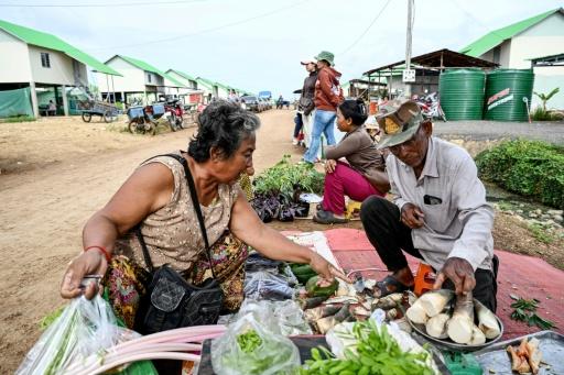 Residents of Cambodia's 'waiting village' have set up coffee shops, salons and grocery stores as they try to rebuild their lives — TANG CHHIN Sothy / AFP