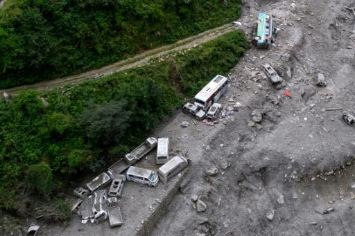 Roads that once connected remote communities have been washed away, while bridges lie destroyed or have completely disappeared — Manan VATSYAYANA / AFP
