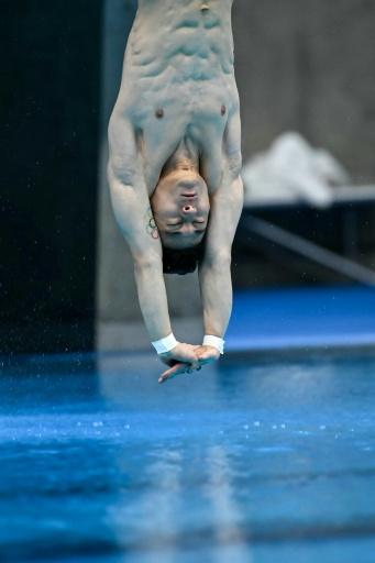 South Korea's Kim Yeong-taek competes in the men's 3m springboard final — ANDREW CABALLERO-REYNOLDS / AFP