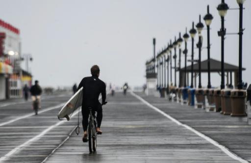 Surfers took advantage of the large waves throughout the week — Matthew HATCHER / AFP