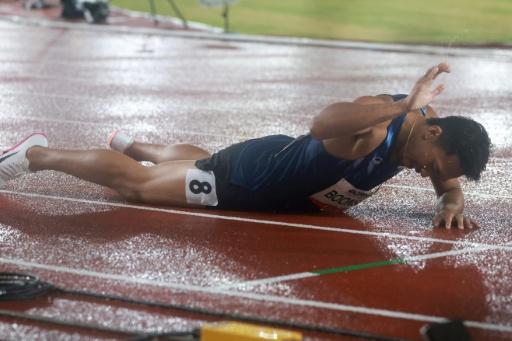 Thailand's Puripol Boonson celebrates setting an Asian record — DAVID GRAY / AFP
