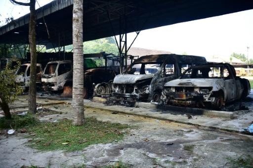 Charred vehicles were seen in the Narathiwat province in August, following dozens of coordinated arson and incendiary attacks across Thailand's insurgency-hit south — Madaree TOHLALA / AFP