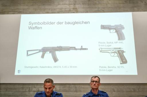Investigators showed photos of weapons identical to those used in the shooting, during a press conference — Fabrice COFFRINI / AFP