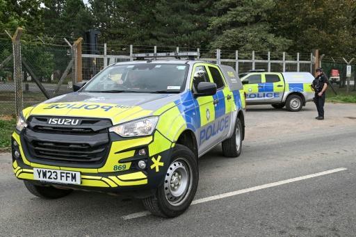 Armed police man a roadblock at an entrance to RAF Fairford base — JUSTIN TALLIS / AFP