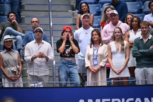 Trinity Rodman (centro) en el palco de Ben Shelton durante la final del US Open el 13 de septiembre de 2026 — ANGELA WEISS / AFP