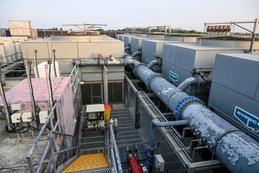 The tower cooling system on the roof of the Digital Realty data centre in Singapore — Roslan RAHMAN / AFP